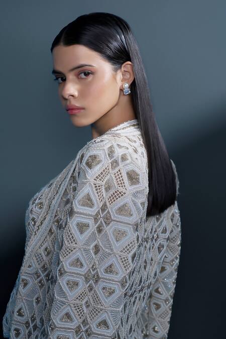 Ritika Mirchandani_Ivory Net, Crepe, Georgette Illume Cutwork Embellished Mesh Blazer Sharara Set _at_Aza_Fashions