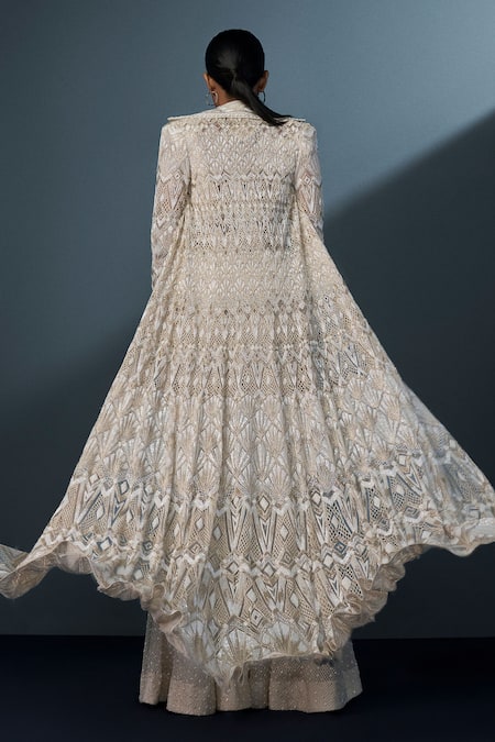 Shop Ritika Mirchandani Ivory Crepe Embellished Crystal Coat Lapel Zephyra Cutwork Trench Sharara Set at Aza Fashions Shop_Ritika Mirchandani_Ivory Crepe Embellished Crystal Coat Lapel Zephyra Cutwork Trench Sharara Set _at_Aza_Fashions