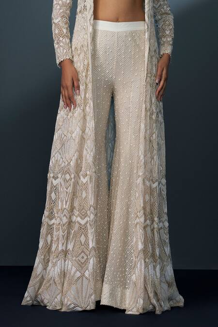 Ritika Mirchandani Ivory Crepe Embellished Crystal Coat Lapel Zephyra Cutwork Trench Sharara Set at Aza Fashions Ritika Mirchandani_Ivory Crepe Embellished Crystal Coat Lapel Zephyra Cutwork Trench Sharara Set _at_Aza_Fashions