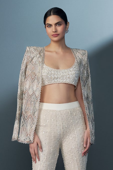 Shop_Ritika Mirchandani_Ivory Net, Crepe, Georgette Zenara Geometric Cutwork Blazer Sharara Set _at_Aza_Fashions