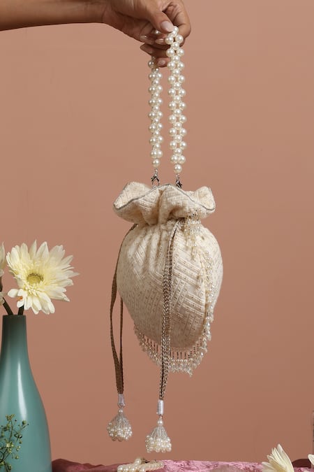 Buy Swabhimann White Embroidery, Beads Broken Stripe Potli Online at Aza Fashions Buy_Swabhimann_White Embroidery, Beads Broken Stripe Potli _Online_at_Aza_Fashions