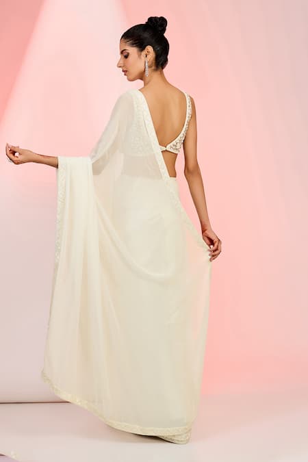 Shop_Meenagurnam_Ivory Georgette, Net Sequins, Beads, Cutdana Embellished Hem Saree With Blouse _at_Aza_Fashions