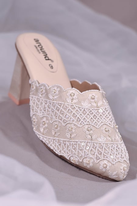 Shop Around Always Ivory Cut Work, Embroidery Celeste Floral Cutwork Mule Heels at Aza Fashions Shop_Around Always_Ivory Cut Work, Embroidery Celeste Floral Cutwork Mule Heels _at_Aza_Fashions