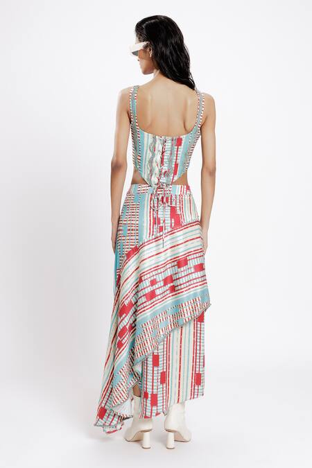 Shop Doh Tak Keh Red Bemberg Twill Satin Print Local Asymmetrical Skirt at Aza Fashions Shop_Doh Tak Keh_Red Bemberg Twill Satin Print Local Asymmetrical Skirt_at_Aza_Fashions