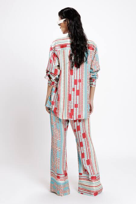 Shop Doh Tak Keh Red Bemberg Twill Satin Print Local Bell Bottom Trouser at Aza Fashions Shop_Doh Tak Keh_Red Bemberg Twill Satin Print Local Bell Bottom Trouser_at_Aza_Fashions