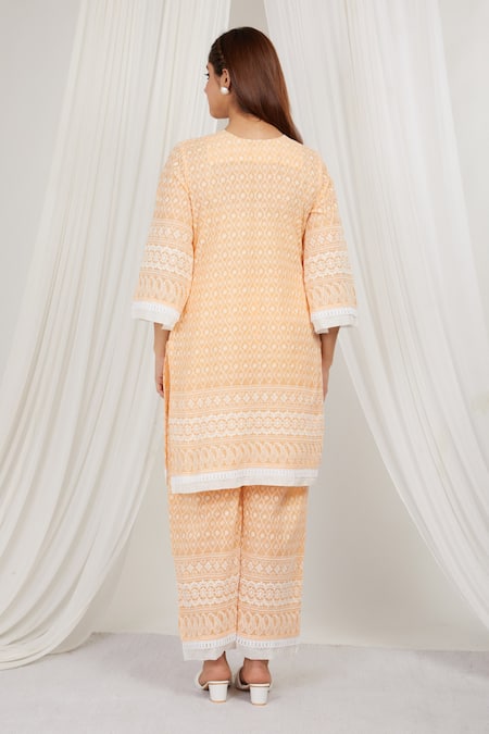 Shop Label Muslin Orange Cotton Embroidery Asymmetric Papaya Kurta With Pant at Aza Fashions Shop_Label Muslin_Orange Cotton Embroidery Asymmetric Papaya Kurta With Pant _at_Aza_Fashions