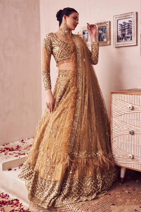 Swish By Dolcy And Simran Gold Net, Linen Beads, Feathers, Dripping Gul Embroidered Bridal Lehenga Set Online at Aza Fashions Swish By Dolcy And Simran_Gold Net, Linen Beads, Feathers, Dripping Gul Embroidered Bridal Lehenga Set _Online_at_Aza_Fashions