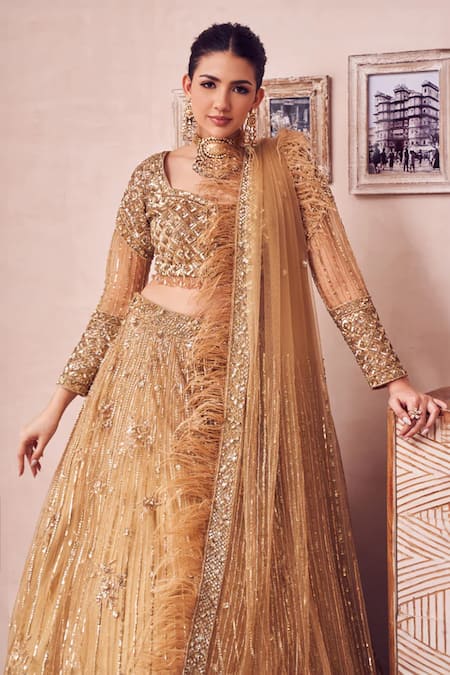 Buy Swish By Dolcy And Simran Gold Net, Linen Beads, Feathers, Dripping Gul Embroidered Bridal Lehenga Set Online at Aza Fashions Buy_Swish By Dolcy And Simran_Gold Net, Linen Beads, Feathers, Dripping Gul Embroidered Bridal Lehenga Set _Online_at_Aza_Fashions
