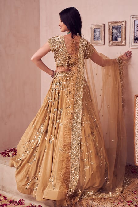 Shop Swish By Dolcy And Simran Gold Net, Crepe, Linen Sequins, Crystals, Royale Ambrosia Bridal Lehenga Set at Aza Fashions Shop_Swish By Dolcy And Simran_Gold Net, Crepe, Linen Sequins, Crystals, Royale Ambrosia Bridal Lehenga Set _at_Aza_Fashions