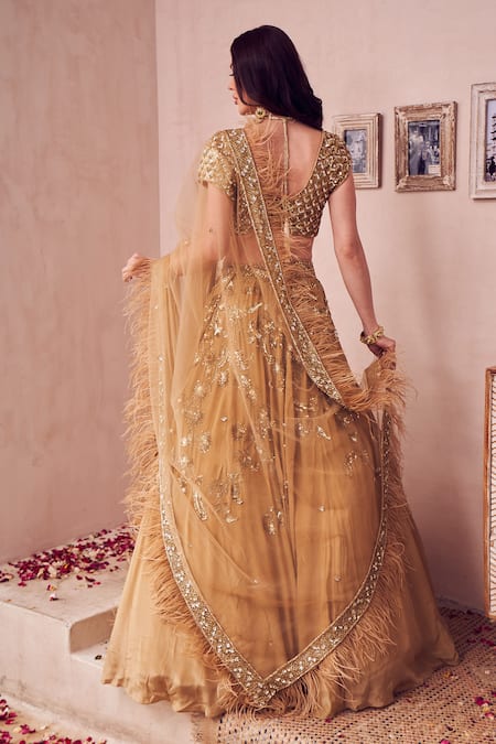 Shop Swish By Dolcy And Simran Gold Net, Crepe Sequins, Beads, Bloomy Ambrosia Embroidered Bridal Lehenga Set at Aza Fashions Shop_Swish By Dolcy And Simran_Gold Net, Crepe Sequins, Beads, Bloomy Ambrosia Embroidered Bridal Lehenga Set _at_Aza_Fashions
