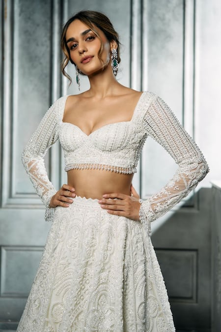 Isa By Dolly Wahal_Ivory Net Cut Work, Sequins, Pearls Sweetheart Neck Ira Embroidered Lehenga Set _Online_at_Aza_Fashions
