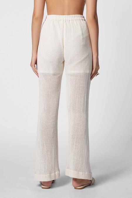 Shop Ekastories White Cotton Luxe Mesh Leisure Bootcut Pant at Aza Fashions Shop_Ekastories_White Cotton Luxe Mesh Leisure Bootcut Pant_at_Aza_Fashions