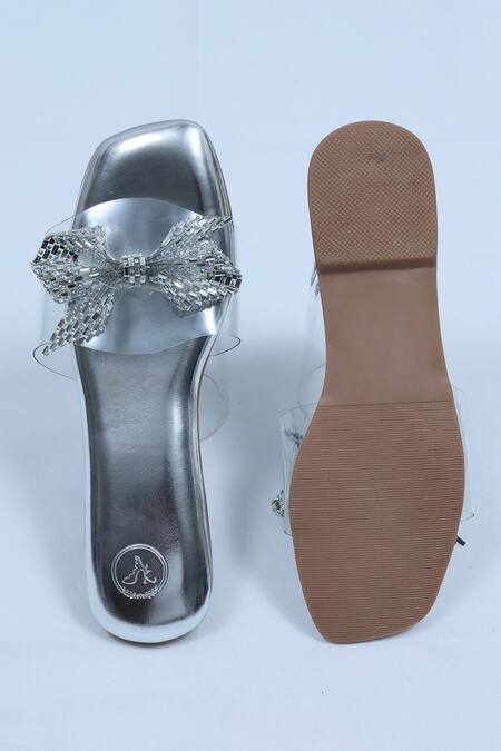 Shop Sana K luxurious Footwear Silver Bow Strap Embellished Flats at Aza Fashions Shop_Sana K luxurious Footwear_Silver Bow Strap Embellished Flats _at_Aza_Fashions