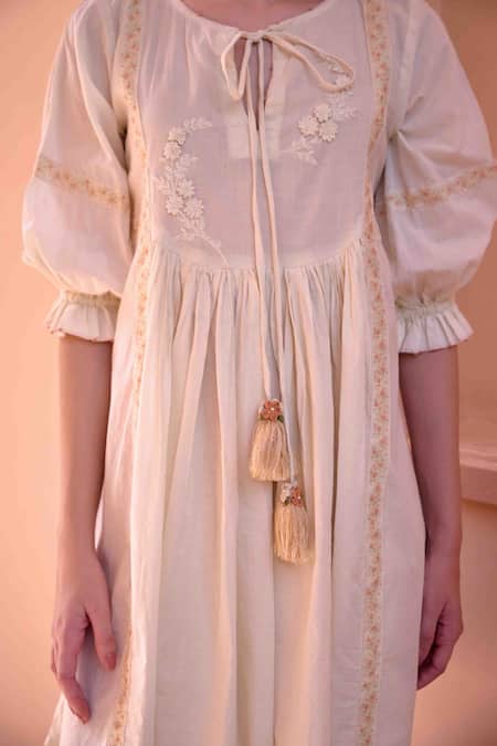 Shop OurDve Beige Cotton Tassels Floral Embroidered Bodice Dress For Kids Online at Aza Fashions Shop_OurDve_Beige Cotton Tassels Floral Embroidered Bodice Dress For Kids_Online_at_Aza_Fashions