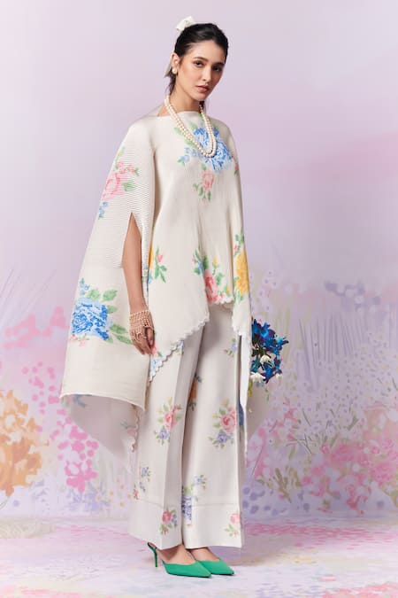 Shop Moh India Ivory Ply Satin Cape Embroidery Cross-stitch Rose Summer With Trouser Online at Aza Fashions Shop_Moh India_Ivory Ply Satin Cape Embroidery Cross-stitch Rose Summer With Trouser _Online_at_Aza_Fashions