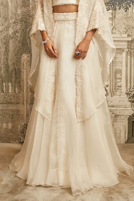 Prisho Ivory Silk, Organza Tonal Resham Embroidered Asymmetric Cape Lehenga Set Online at Aza Fashions Prisho_Ivory Silk, Organza Tonal Resham Embroidered Asymmetric Cape Lehenga Set _Online_at_Aza_Fashions