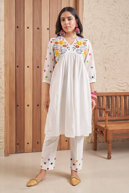 Buy_Samatvam By Anjali Bhaskar_Ivory Cotton, Muslin Tassels, Adila Floral Embroidered Yoke Kurta And Pant Set _Online_at_Aza_Fashions