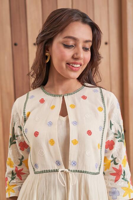 Samatvam By Anjali Bhaskar Beige Cotton Embroidery, Lace, Applique, Tassels Diti Floral Jacket And Pant Set Online at Aza Fashions Samatvam By Anjali Bhaskar_Beige Cotton Embroidery, Lace, Applique, Tassels Diti Floral Jacket And Pant Set _Online_at_Aza_Fashions