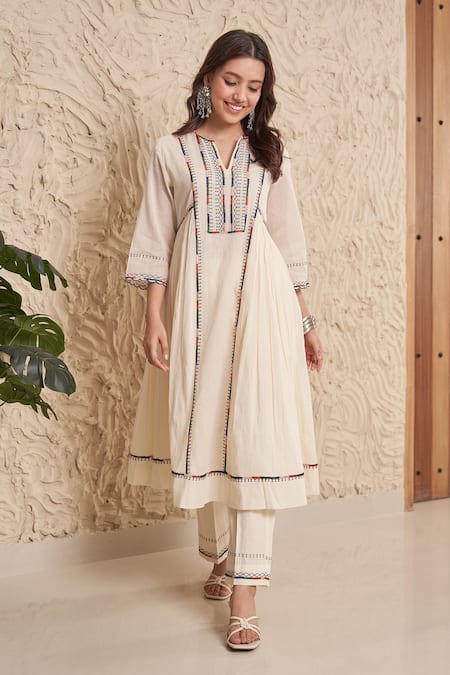 Samatvam By Anjali Bhaskar Ivory Muslin, Cotton Tassels, Embroidery Idhi Thread Gathered Kurta And Pant Set at Aza Fashions Samatvam By Anjali Bhaskar_Ivory Muslin, Cotton Tassels, Embroidery Idhi Thread Gathered Kurta And Pant Set _at_Aza_Fashions