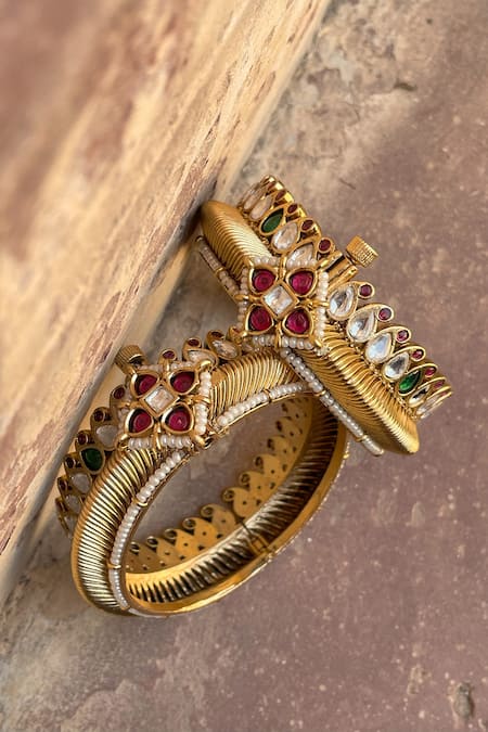 Shop Saga Jewels Gold Plated Pearls, Gota Rajwadi Kundan Embellished Carved Kadas - Set Of 2 at Aza Fashions Shop_Saga Jewels_Gold Plated Pearls, Gota Rajwadi Kundan Embellished Carved Kadas - Set Of 2 _at_Aza_Fashions