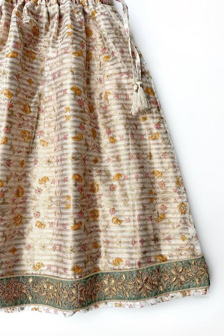 Taramira_Ivory Brocade Woven Flora Vine Blouse Lehenga Set_Online_at_Aza_Fashions