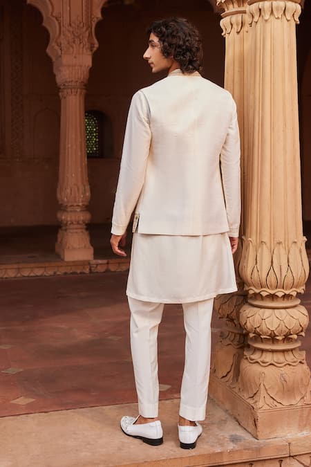 Shop Contrast By Parth Ivory Silk Zari, Cut Work, Mirrors Zardozi Embellished Bundi And Kurta Set at Aza Fashions Shop_Contrast By Parth_Ivory Silk Zari, Cut Work, Mirrors Zardozi Embellished Bundi And Kurta Set _at_Aza_Fashions