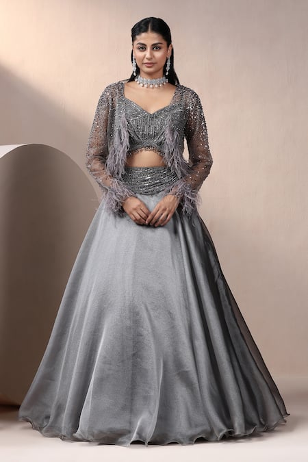 Chaashni by Maansi and Ketan Grey Shimmer Organza Embellished Pearl Blouse Bead Waist Lehenga Set With Cape 