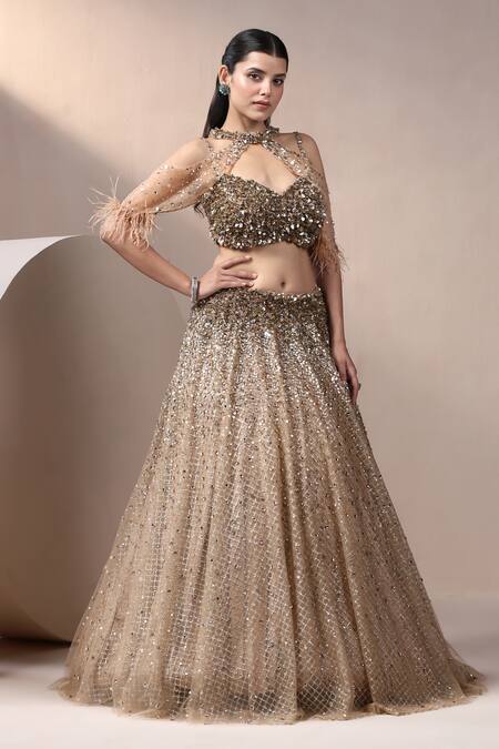 Shop_Chaashni By Maansi And Ketan_Gold Net, Silk Pearls, Sequins, Beads Plunge Embroidered Lehenga Set With Cape_Online_at_Aza_Fashions