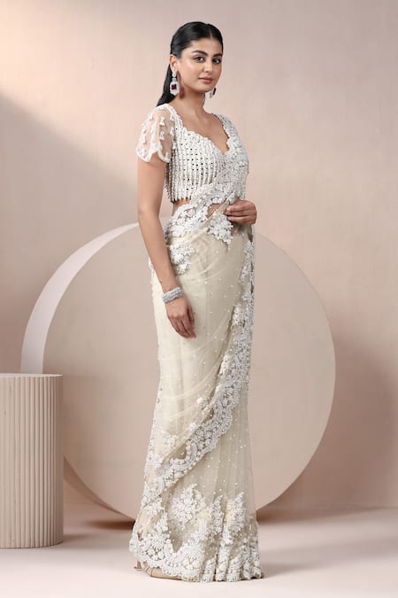 Chaashni By Maansi And Ketan_Off White Net Sequins, Pearls Plunge Embroidered Scallop Hem Saree With Blouse _at_Aza_Fashions