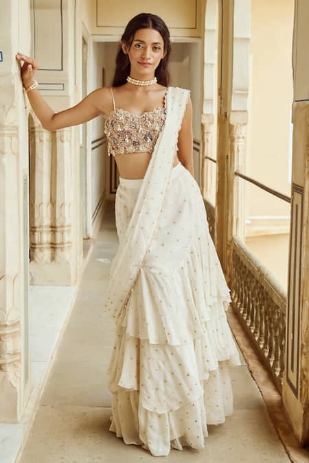 Shop Nikita Vishakha Ivory Organza, Satin Sequins, Tassels, Embroidery Tiered Saree With Blouse Online at Aza Fashions Shop_Nikita Vishakha_Ivory Organza, Satin Sequins, Tassels, Embroidery Tiered Saree With Blouse _Online_at_Aza_Fashions