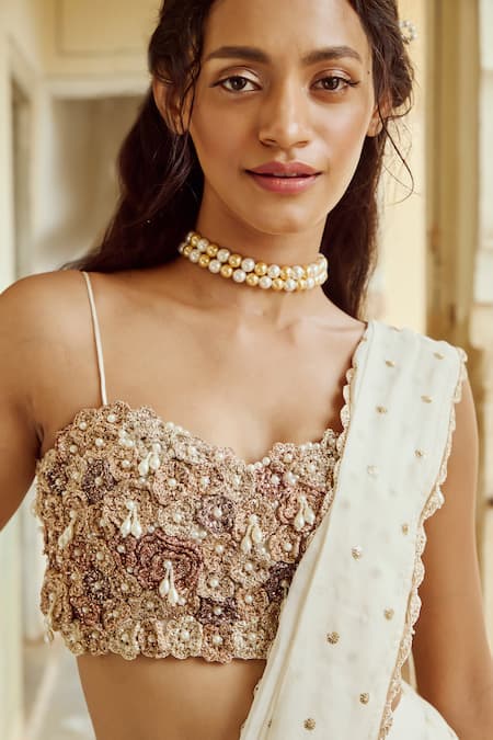 Nikita Vishakha Ivory Organza, Satin Sequins, Tassels, Embroidery Tiered Saree With Blouse at Aza Fashions Nikita Vishakha_Ivory Organza, Satin Sequins, Tassels, Embroidery Tiered Saree With Blouse _at_Aza_Fashions