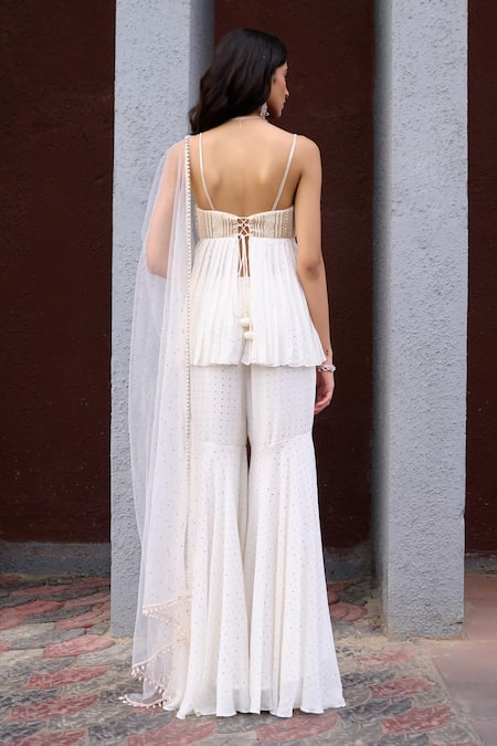 Chamee And Palak Ivory Georgette, Net, Silk, Tulle Pearls, Nyra Embroidered Peplum Sharara Set Online at Aza Fashions Chamee And Palak_Ivory Georgette, Net, Silk, Tulle Pearls, Nyra Embroidered Peplum Sharara Set _Online_at_Aza_Fashions