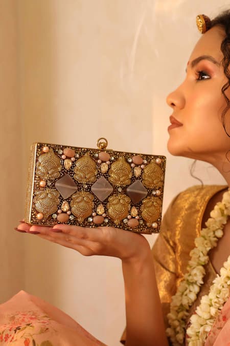 THE TAN CLAN Arya Floral Carved Clutch 