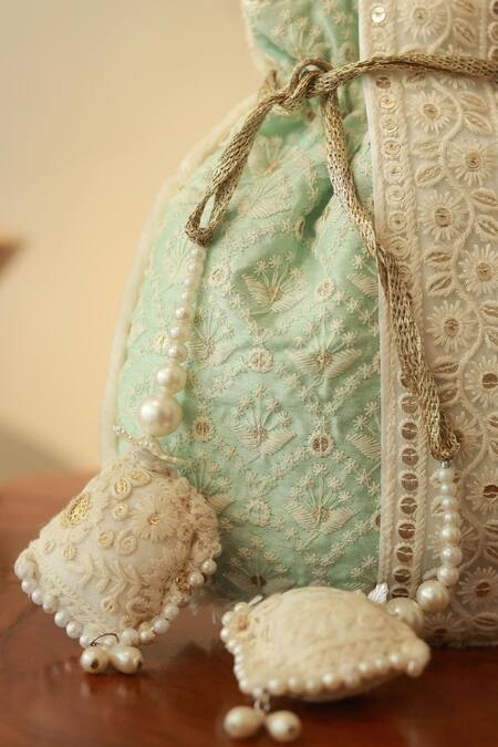 The Tan Clan Blue Thread Ruhi And Sequin Potli Bag at Aza Fashions The Tan Clan_Blue Thread Ruhi And Sequin Potli Bag _at_Aza_Fashions