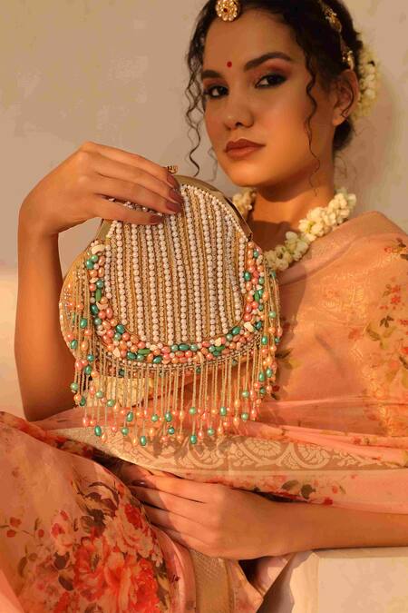 The Tan Clan Gold Pearl Sona And Tassel Embroidered Batua Bag at Aza Fashions The Tan Clan_Gold Pearl Sona And Tassel Embroidered Batua Bag _at_Aza_Fashions