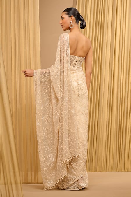 Shop Tarun Tahiliani Ivory Tulle Pearls, Sequins Sweetheart Neck Hand Embroidered Saree With Bustier at Aza Fashions Shop_Tarun Tahiliani_Ivory Tulle Pearls, Sequins Sweetheart Neck Hand Embroidered Saree With Bustier _at_Aza_Fashions
