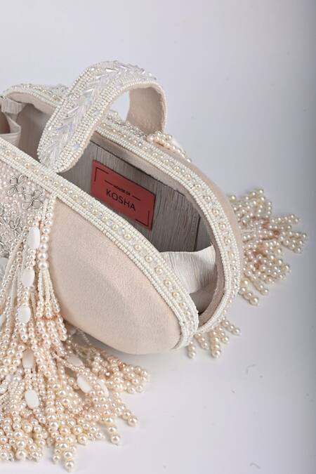 House Of Kosha Ivory Cut Work, Beads, Zari Azmat Capsule Shaped Bag Online at Aza Fashions House Of Kosha_Ivory Cut Work, Beads, Zari Azmat Capsule Shaped Bag _Online_at_Aza_Fashions