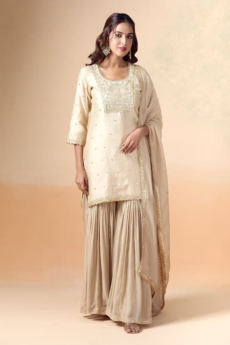 Kalakaari By Sagarika Beige Chanderi Silk Hand Embroidery Floral Round Gota Patti Kurta Gharara Set 