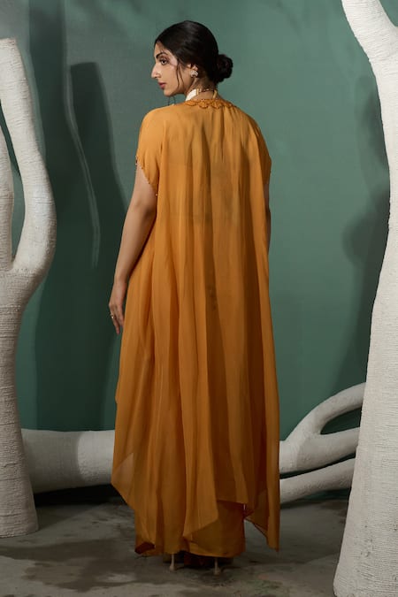 One Knot One By Ashna Yellow Silk Satin, Crepe Marigold Flora Embroidered Cape Draped Skirt Set Online at Aza Fashions One Knot One By Ashna_Yellow Silk Satin, Crepe Marigold Flora Embroidered Cape Draped Skirt Set _Online_at_Aza_Fashions