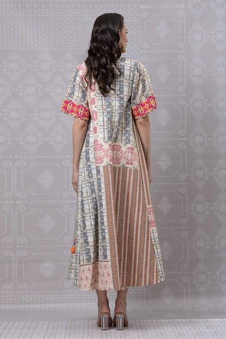 Shop Niki Mahajan Beige Crepe Tassels Round Neck Geometric Floral Print Dress With Cape at Aza Fashions Shop_Niki Mahajan_Beige Crepe Tassels Round Neck Geometric Floral Print Dress With Cape _at_Aza_Fashions
