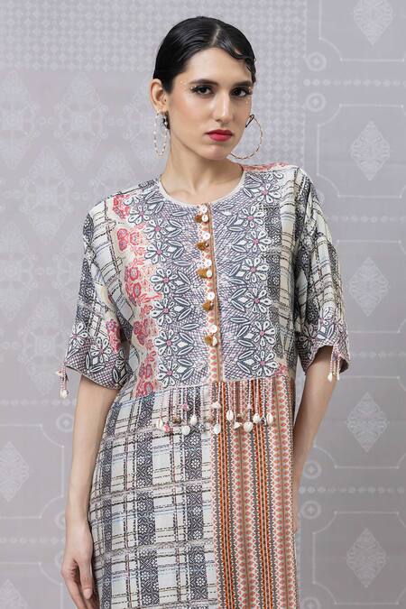 Niki Mahajan Beige Crepe Printed Vintage Floral Round Beaded Kurta With Draped Pant at Aza Fashions Niki Mahajan_Beige Crepe Printed Vintage Floral Round Beaded Kurta With Draped Pant _at_Aza_Fashions
