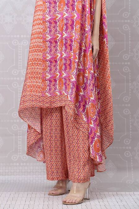 Niki Mahajan_Red Crepe Pearls, Sequins Round Neck Asymmetric Hand Embroidered Kurta With Pant _at_Aza_Fashions