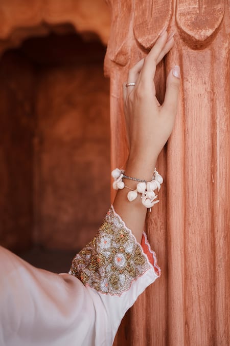 House Of Anmol Jain White Satin Cut Work V-neck Ratna Floral Embroidered Kurta With Pant at Aza Fashions House Of Anmol Jain_White Satin Cut Work V-neck Ratna Floral Embroidered Kurta With Pant _at_Aza_Fashions