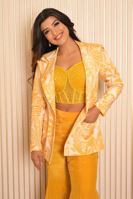 Vridhi Somaani_Yellow Net, Silk, Crepe Cut Work Amelia Tropical Print Blazer And Flared Pant Set _at_Aza_Fashions