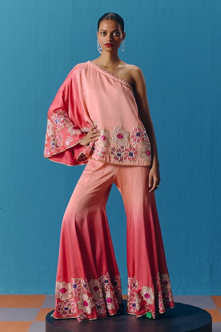 Buy Pooja Rajgarhia Gupta Peach Silk Satin Sequins One Twilight Asymmetric Top With Bell Bottom Pant Online at Aza Fashions Buy_Pooja Rajgarhia Gupta_Peach Silk Satin Sequins One Twilight Asymmetric Top With Bell Bottom Pant _Online_at_Aza_Fashions