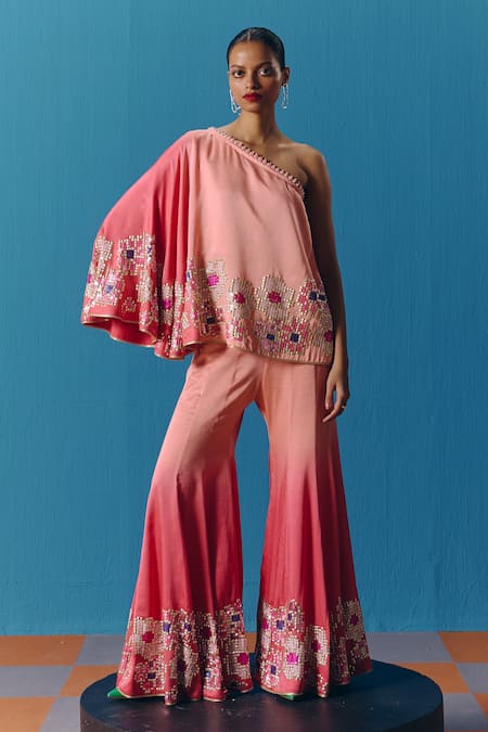Pooja Rajgarhia Gupta Peach Silk Satin Sequins One Twilight Asymmetric Top With Bell Bottom Pant at Aza Fashions Pooja Rajgarhia Gupta_Peach Silk Satin Sequins One Twilight Asymmetric Top With Bell Bottom Pant _at_Aza_Fashions
