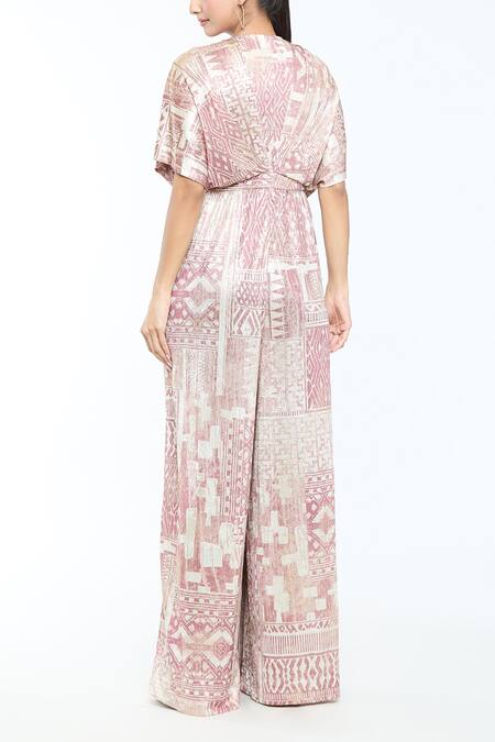 Shop Tarun Tahiliani Pink Foil Jersey Printed Geometric Overlapping V Neck Pattern Flared Jumpsuit at Aza Fashions Shop_Tarun Tahiliani_Pink Foil Jersey Printed Geometric Overlapping V Neck Pattern Flared Jumpsuit_at_Aza_Fashions