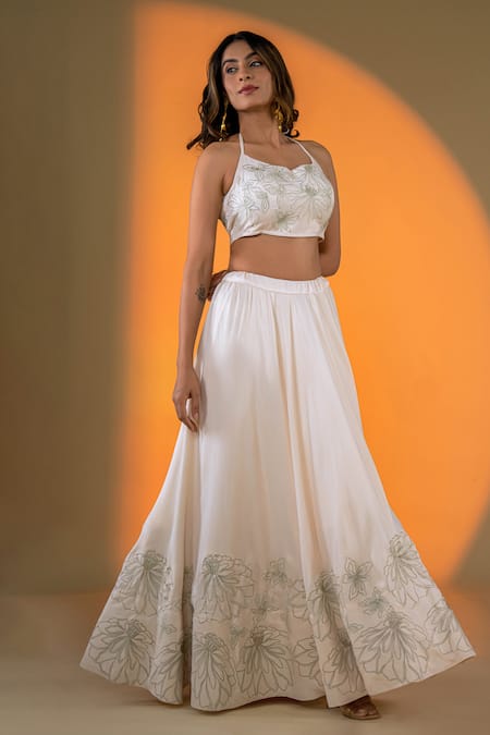 Shop Amrood Off White Satin Embroidery Halter Neck Lily Bloom Lehenga With Blouse at Aza Fashions Shop_Amrood_Off White Satin Embroidery Halter Neck Lily Bloom Lehenga With Blouse _at_Aza_Fashions