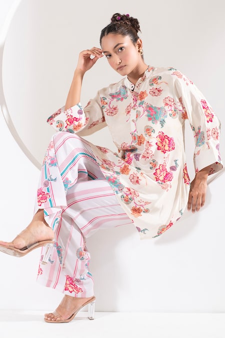 Shop Ekavira Ivory Crepe, Silk Embroidery Mandarin Bella Floral Print Short Kurta With Pant at Aza Fashions Shop_Ekavira_Ivory Crepe, Silk Embroidery Mandarin Bella Floral Print Short Kurta With Pant _at_Aza_Fashions