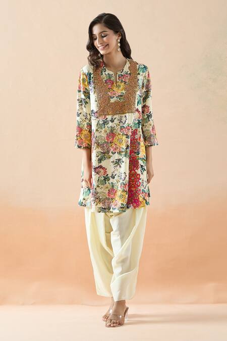 Debyani + CO Ivory Silk Embroidery Split V-neck Botanical Print Short Kurta And Dhoti Pant Set at Aza Fashions Debyani + CO_Ivory Silk Embroidery Split V-neck Botanical Print Short Kurta And Dhoti Pant Set _at_Aza_Fashions